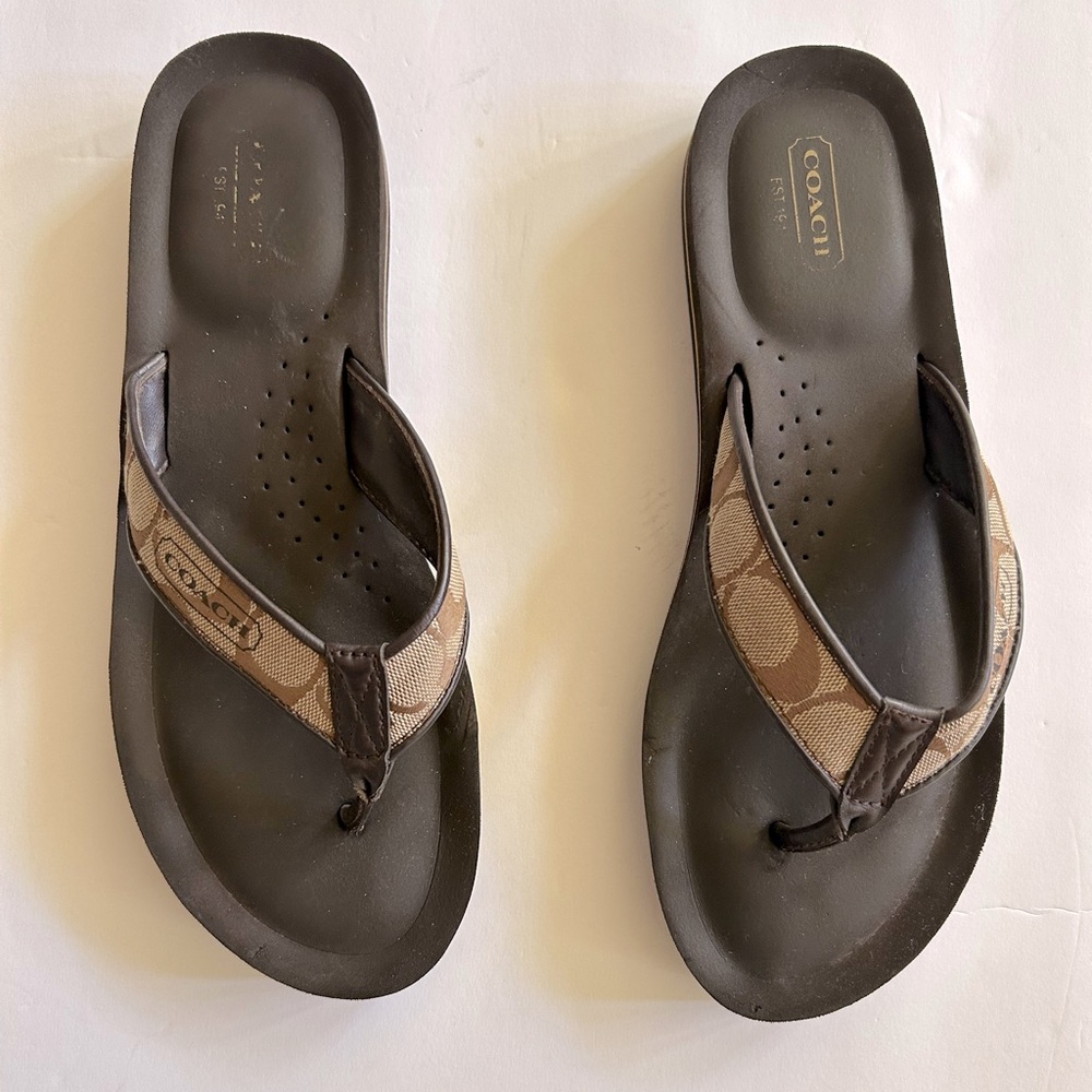 Coach logo flip flops.